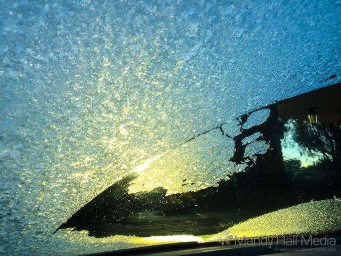 Sunlight through the ice on the windscreen