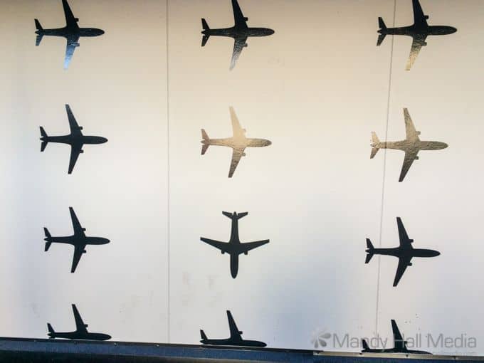 Mural at the airport. Not sure about the plane going down…