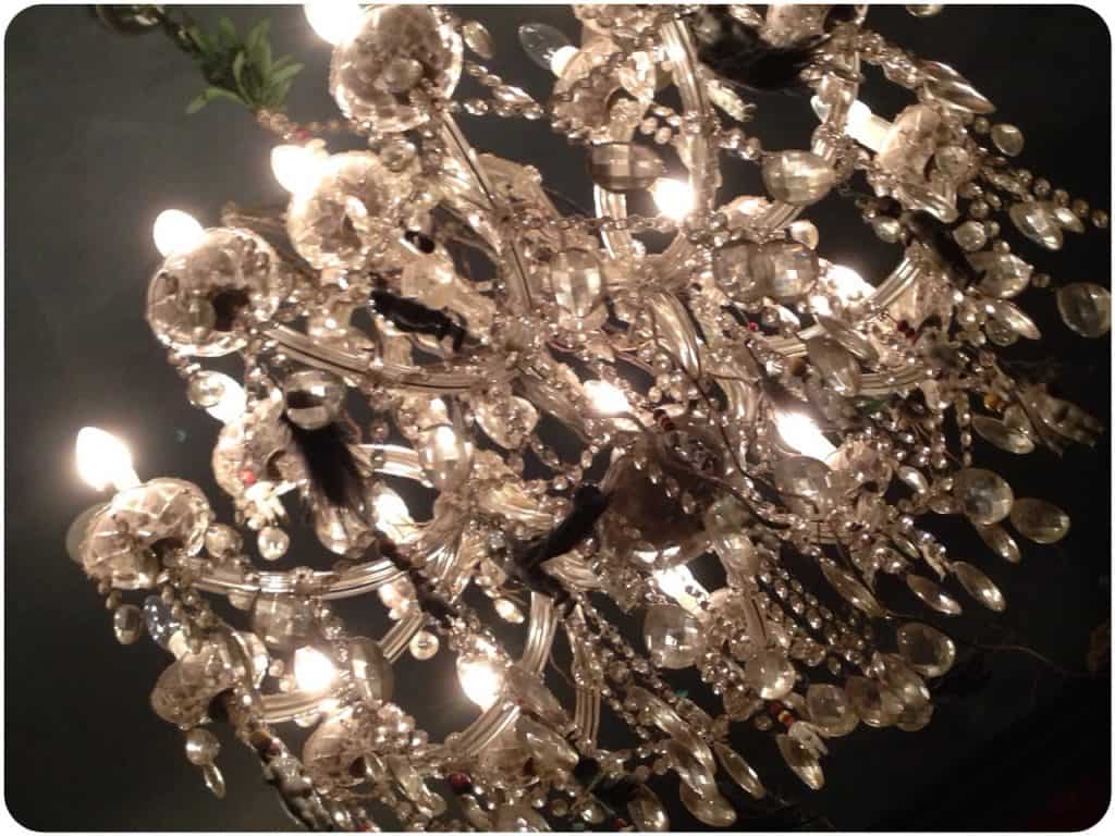 Chandelier. Look closely to see feathers, babies and other assorted paraphernalia
