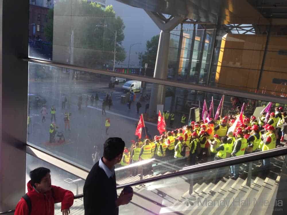 Workers union protest on the steps at Southern Cross Station