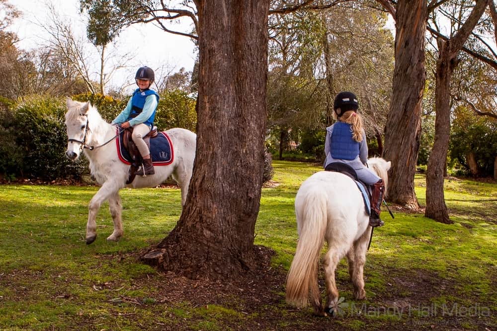 Sisters on their ponies