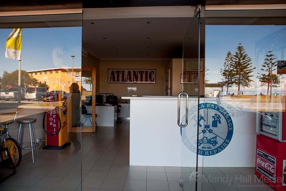 Atlantic Petrol sign in a car repair shop