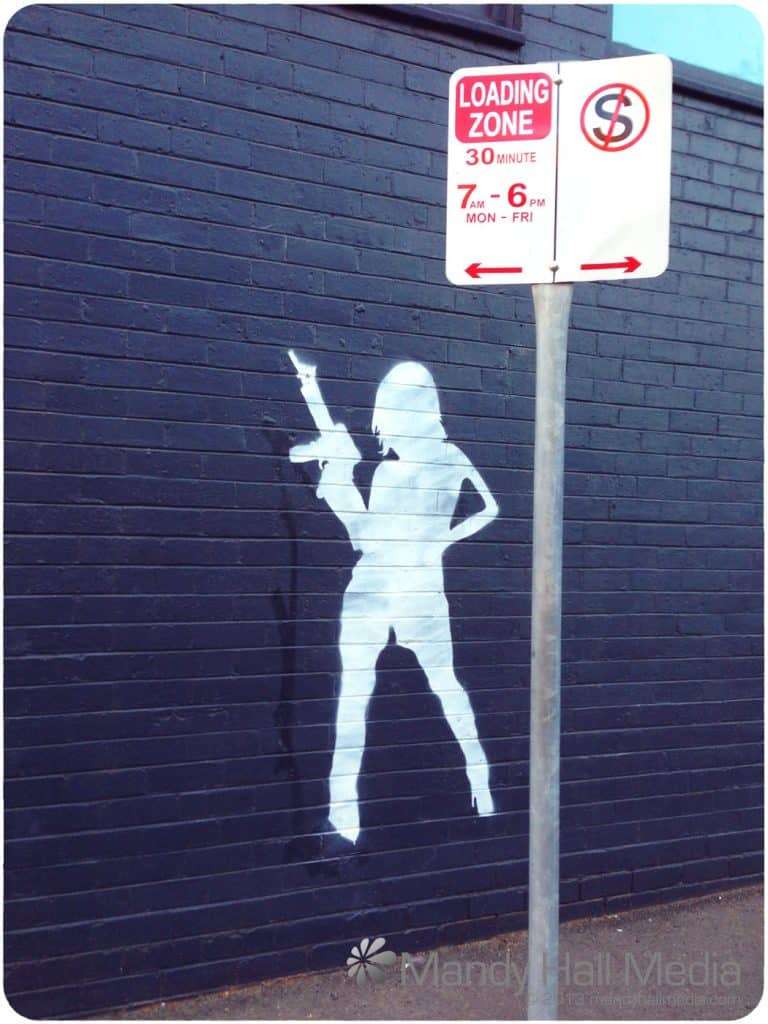 Girl with a gun. Hope she doesn’t try walking anywhere.