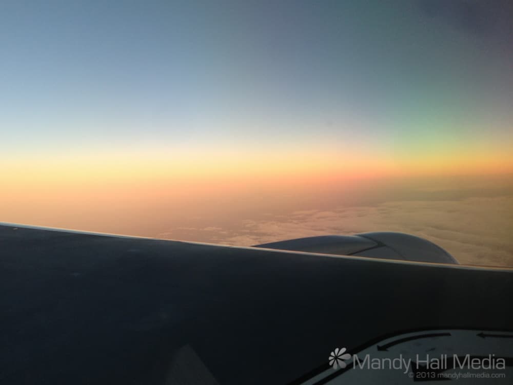 Rainbow sunset from the plane. I haven’t seen this before. Lovely.