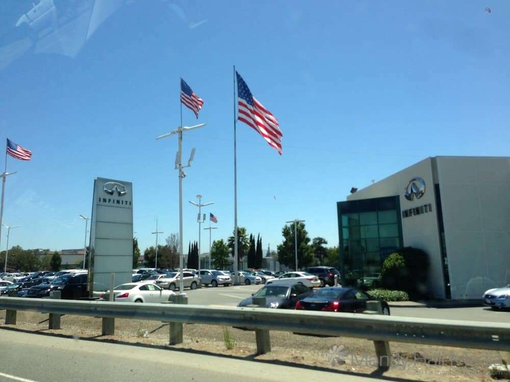 Car dealership in San Fransisco. American flags everywhere.