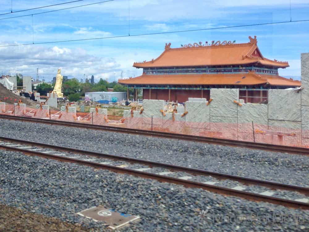 The golden buddha at a temple outside Melbourne. Seen from the train.
