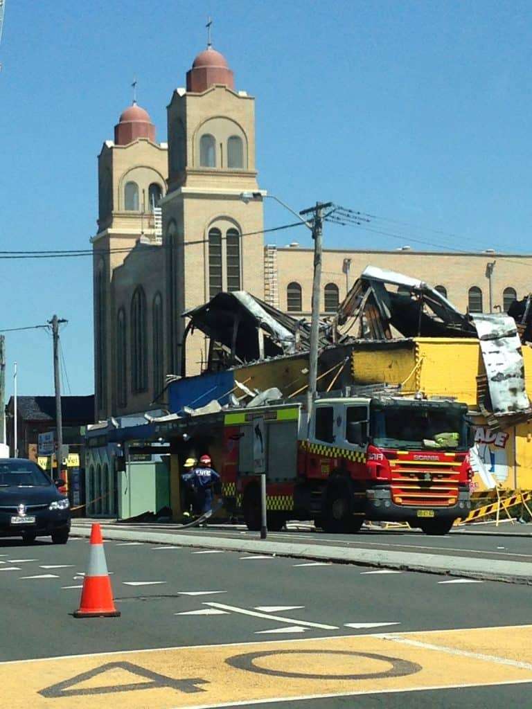Big fire in an electrical store. It was still smoking when we went past.