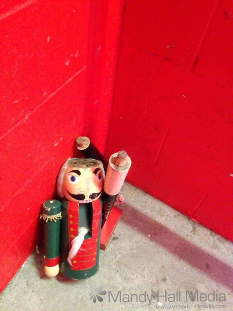 Creepy broken nutcracker man in a stairwell