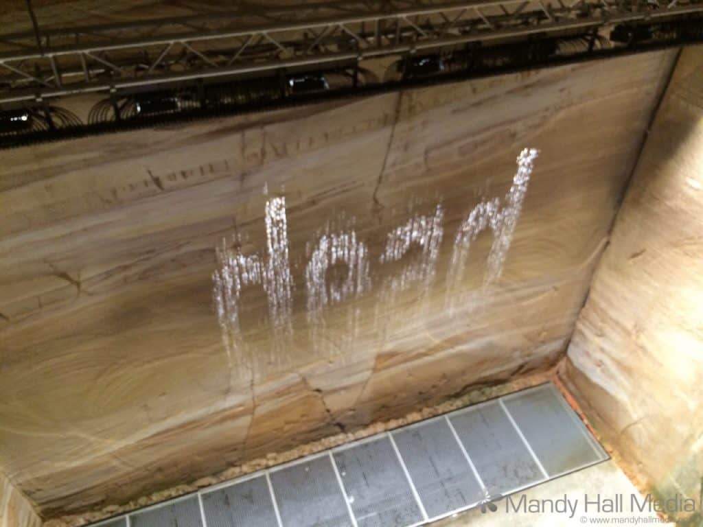MONA Bit.fall by Julius Popp. The water wall displays the top current google search words in showers of water droplets.