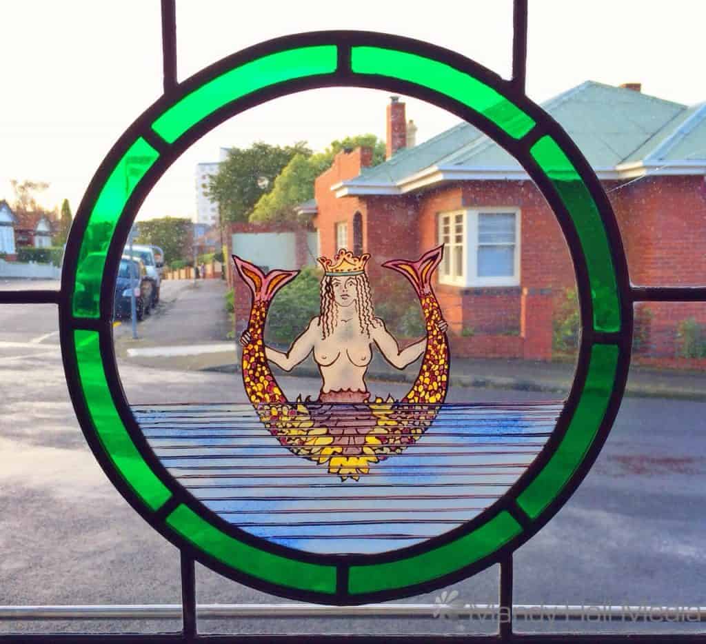 Mermaid stained glass windows in a pub