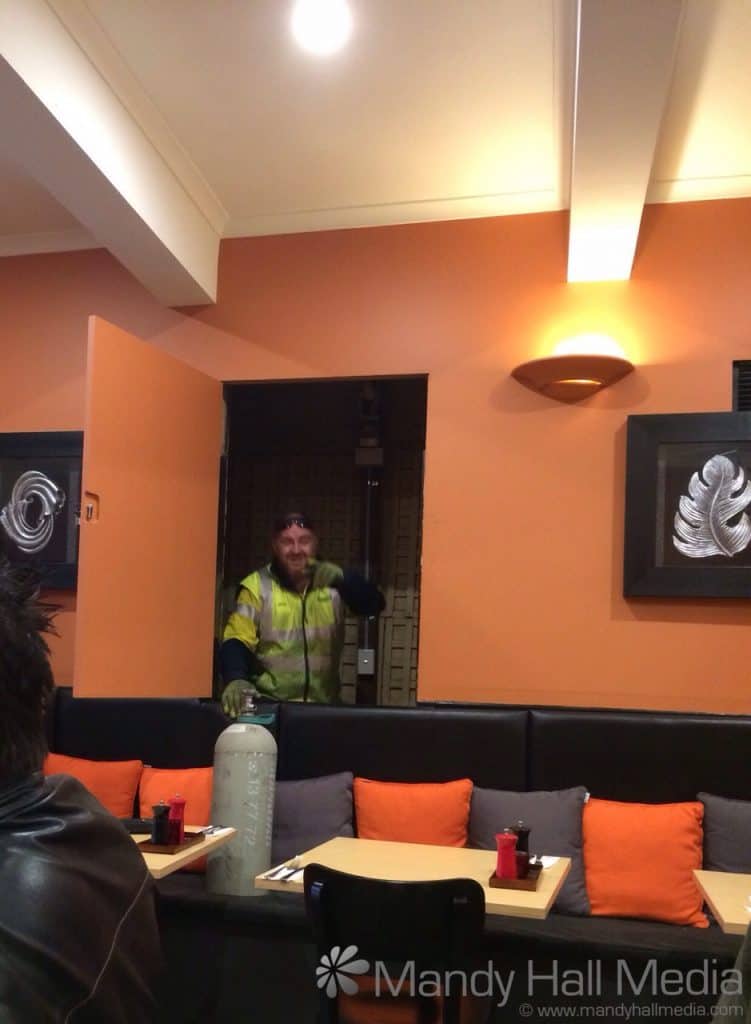 We were eating lunch when a small door in the wall opposite opened and a man climbed out. It was very entertaining.