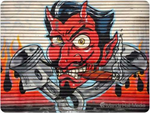 Coop devil graffitti on the door of the old Route 66 store
