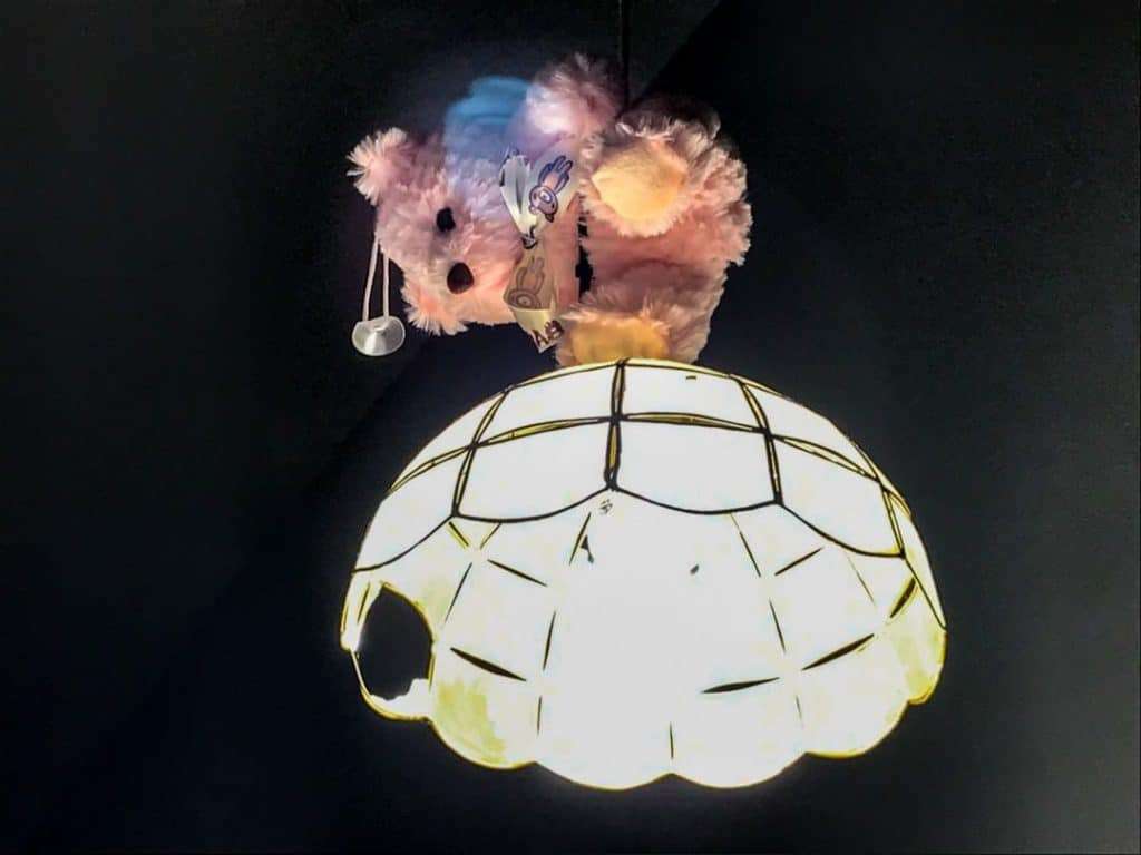 Creepy bear on a light fitting in a haunted hotel